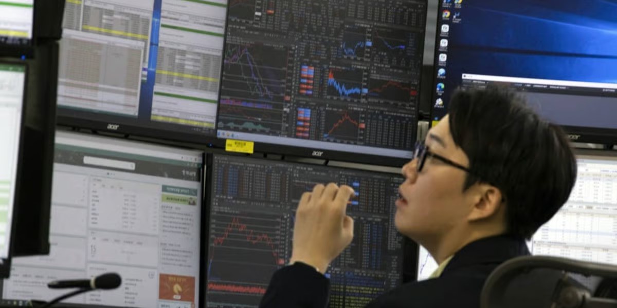 Asian stocks skid as oil slips and bonds rally